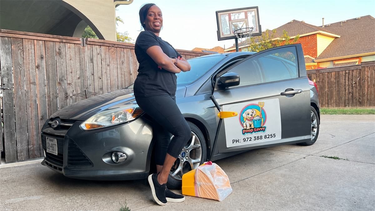 Dee Reed beside a grey Ford Focus carrying a Poop Savvy door magnet with the phone number 972.388.8255
